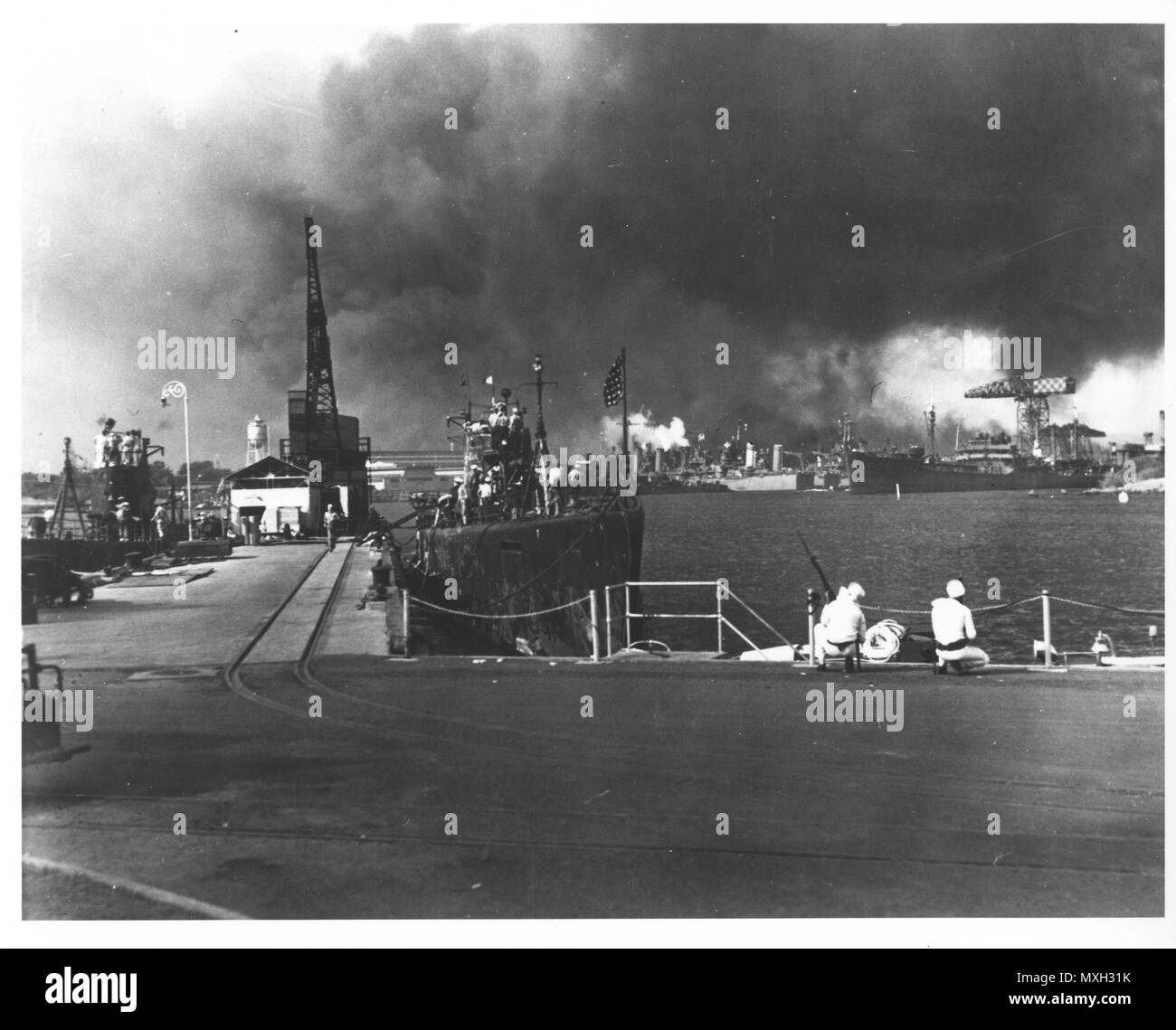 Original caption: Burning and damaged ships after the Japanese attack on Pearl Harbor, Dec. 7 1941. Photo courtesy of the U.S. National Archives and Records Administration. Stock Photo