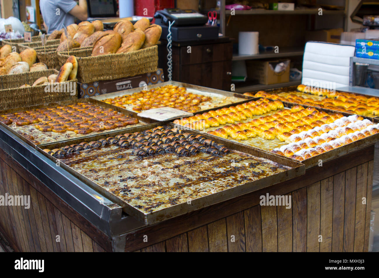 9 May 2018 A large and colourful selection of sweet bread and pastries  prepared and on sale at a stall at the Mahane Yehuda covered market in Jerusal Stock Photo