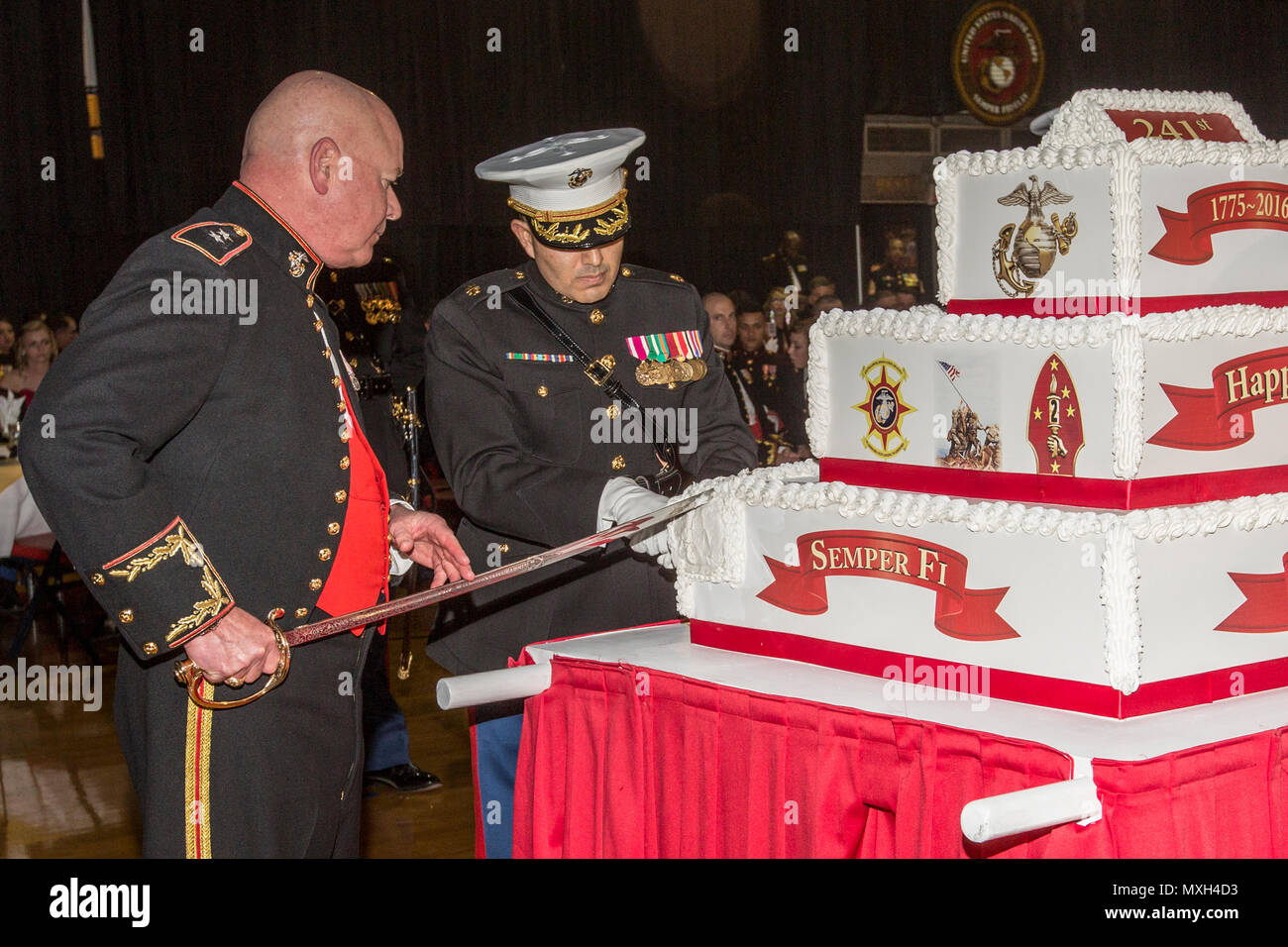 U.S. Marine Corps Maj. Gen. Walter L. Miller, Jr., commanding general of II Marine Expeditionary Force (II MEF), left, cuts a cake at the II MEF Marine Corps Birthday Ball at Marine Corps Base Camp Lejeune, N.C., Nov. 5, 2016. Commandant of the Marine Corps Gen. Robert B. Neller attended the birthday ball as the guest of honor. (U.S. Marine Corps photo by Cpl. Samantha K. Braun) Stock Photo