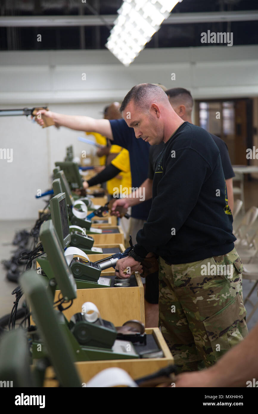 U.S. Army Staff Sgt. John Trotter, Fort Benning, reloads his weapon in ...