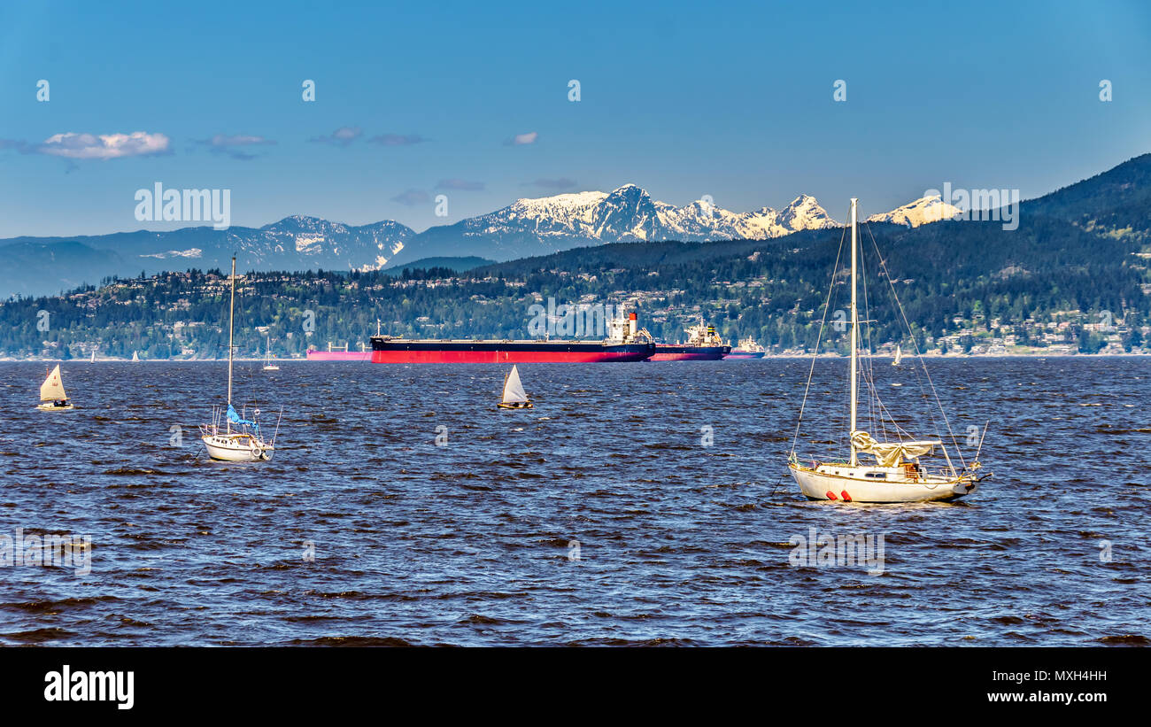 A scenic view of the waters at Vancouver International harbor with the North Shore Mountains in the back ground in beautiful British Columbia, Canada Stock Photo