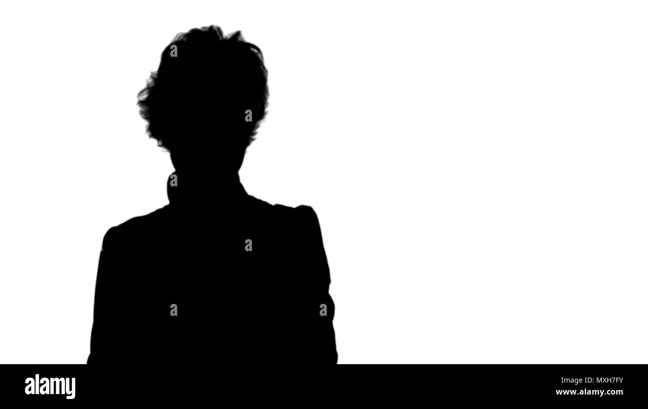 Silhouette Businesswoman taking funny selfie with phone track matte. Stock Photo