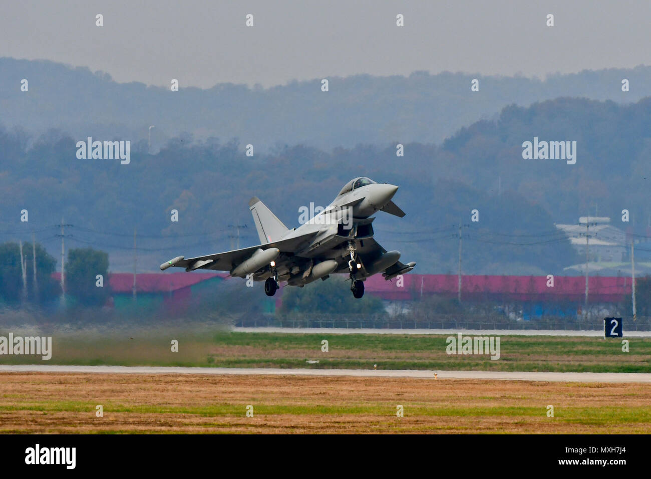 A Royal Air Force Eurofighter Typhoon FRG4 takes off at Osan Air Base, Republic of Korea, Nov. 7, 2016. The RAF deployed the largest number of assets on the Korean Peninsula since the Korean War during Invincible Shield, an interoperability exchange, from Nov. 1 – 10. (U.S. Air Force photo by Senior Airman Victor J. Caputo) Stock Photo