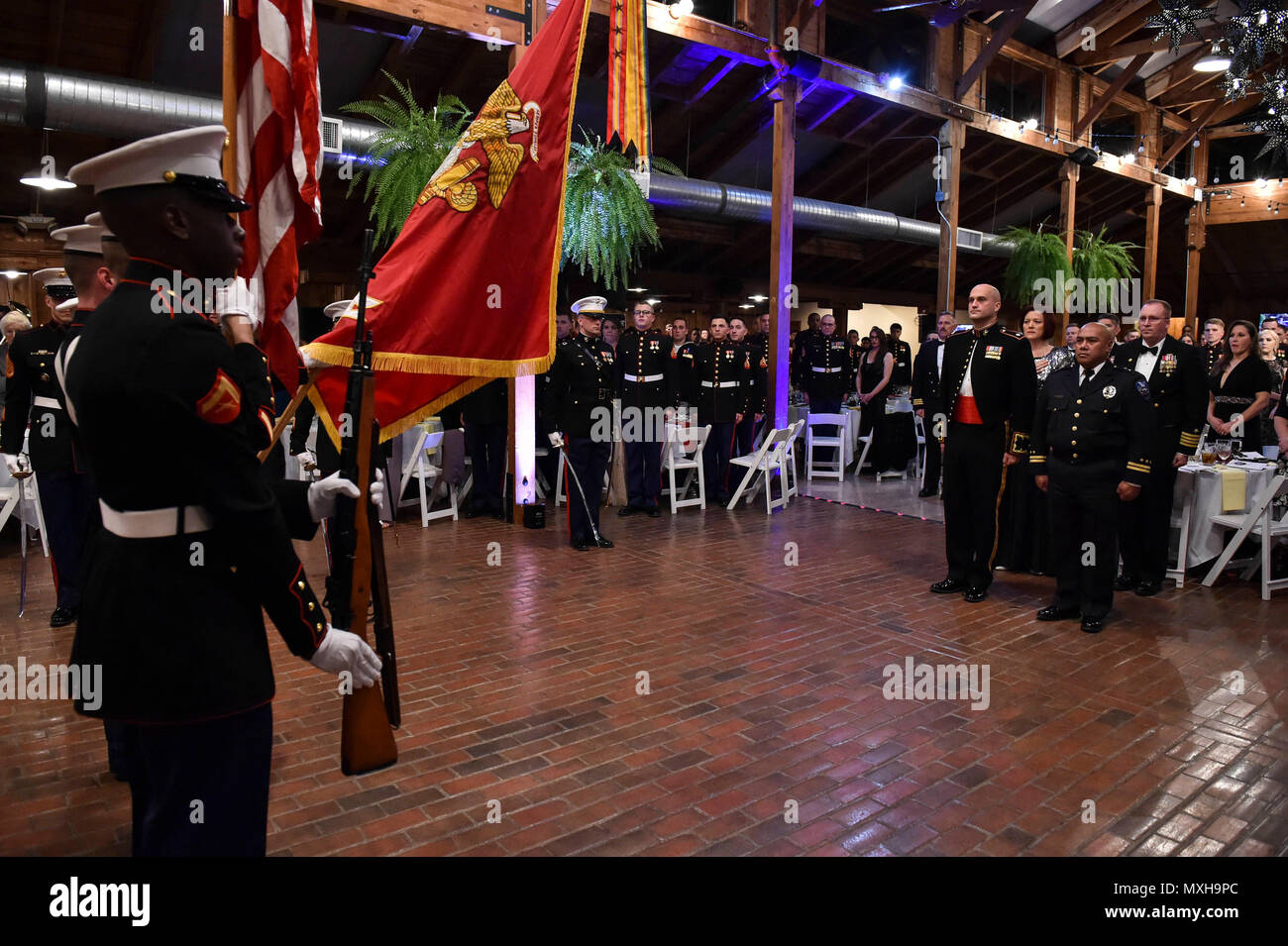 161104-N-OO032-065 POULSBO, Wash. (Nov. 4, 2016) Marine Corps Security Force Battalion (MCSFBn) -Bangor color guard presents the colors during the 241st United States Marine Corps birthday ball hosted by the battalion at the Kiana Lodge. Maj. Gen. John Lejeune issued General Order 47 on November 1, 1921, for Marines to commemorate the establishment of the Continental Marines — November 10, 1775. (U.S. Navy photo by Petty Officer 1st Class Cory Asato/Released) Stock Photo