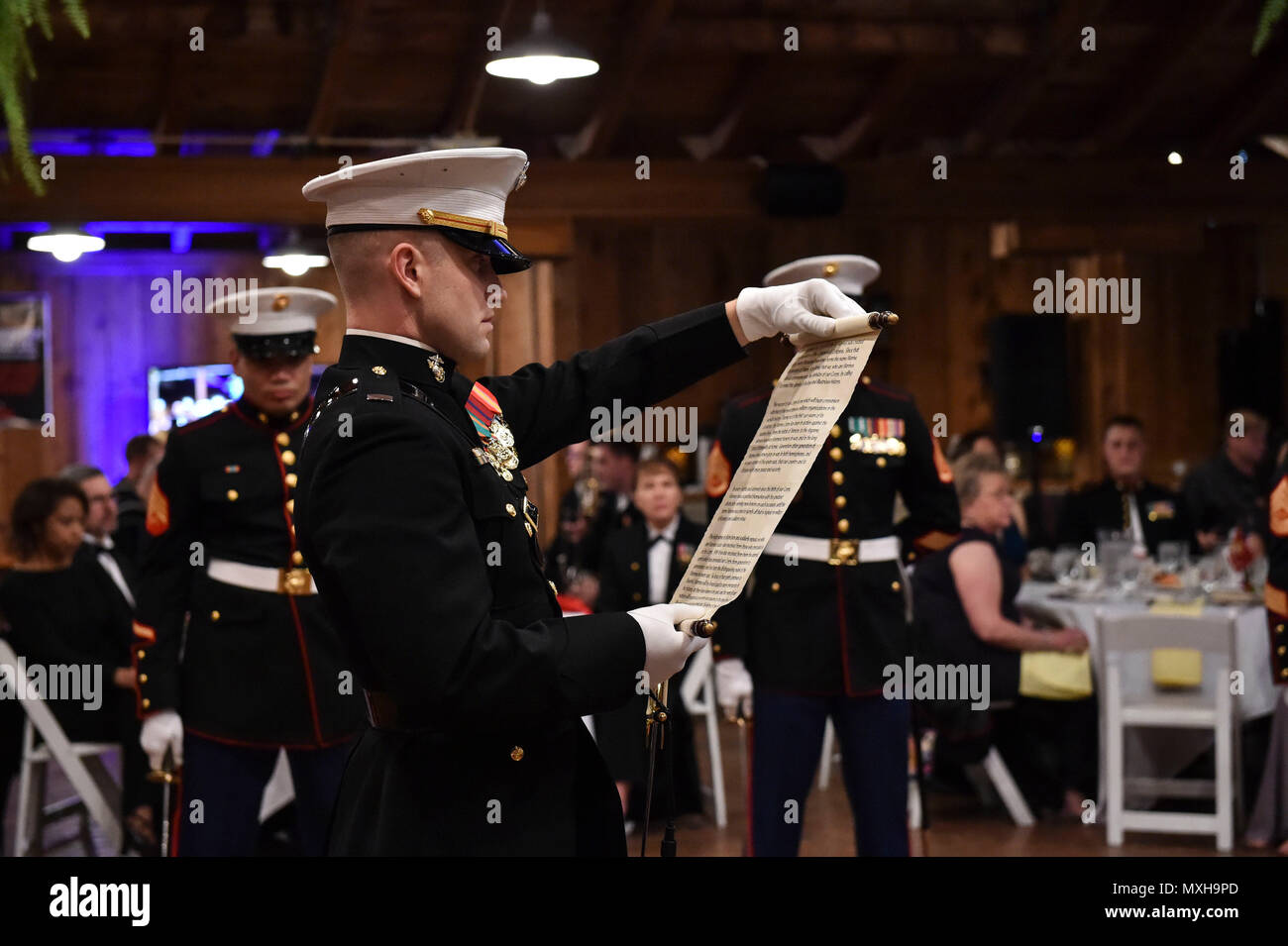 161104-N-OO032-126 POULSBO, Wash. (Nov. 4, 2016) Marine Corps 1st Lt. Derik Henderson, Marine Corps Security Force Battalion-Bangor adjutant, finishes reading Maj. Gen. John Lejeune's General Order 47 during the 241st United States Marine Corps birthday ball hosted by the battalion at the Kiana Lodge. Maj. Gen. John Lejeune issued General Order 47 on November 1, 1921, for Marines to commemorate the establishment of the Continental Marines — November 10, 1775. (U.S. Navy photo by Petty Officer 1st Class Cory Asato/Released) Stock Photo