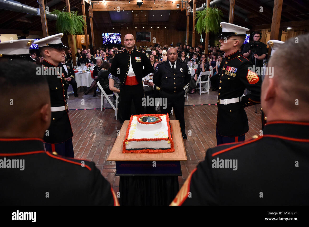 161104-N-OO032-146 POULSBO, Wash. (Nov. 4, 2016) Cake escorts present the birthday cake to Marine Corps Security Force Battalion (MCSFBn) -Bangor commanding officer Lt. Col. Scott Reed, a native of Olean, New York, and retired Marine and Navy veteran Domingo Almirol, the guest of honor and Suquamish Police Department deputy chief of patrol, during the 241st United States Marine Corps birthday ball hosted by MCSFBn at the Kiana Lodge. Maj. Gen. John Lejeune issued General Order 47 on November 1, 1921, for Marines to commemorate the establishment of the Continental Marines — November 10, 1775. ( Stock Photo