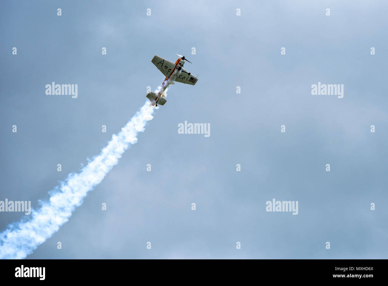 A Twin Tiger YAK 55 conducts acrobatic stunts during the South Carolina National Guard Air and Ground Expo at McEntire Joint National Guard Base, South Carolina, May 5, 2017. This expo is a combined arms demonstration showcasing the abilities of South Carolina National Guard Airmen and Soldiers while saying thank you for the support of fellow South Carolinians and the surrounding community. Stock Photo