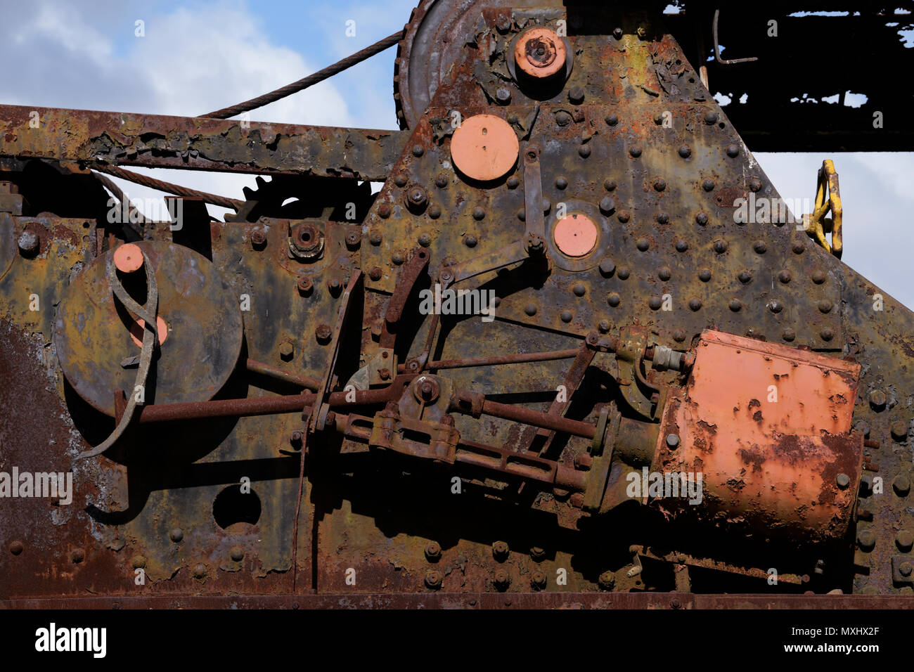 Rust covered linkages, pushrods and mechanical devices on vintage railroad maintenance equipment Stock Photo
