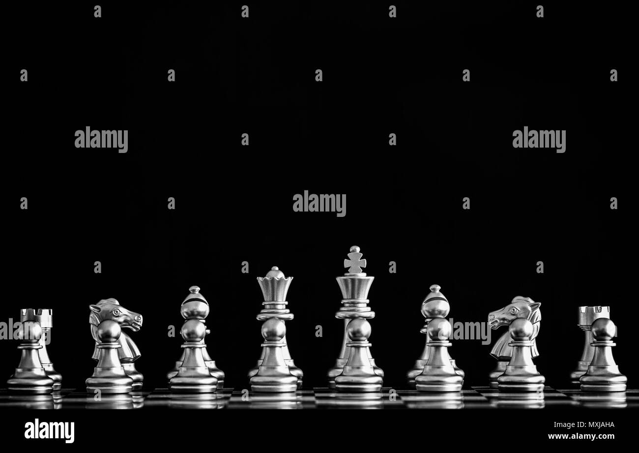 The King in battle chess game stand on chessboard with black