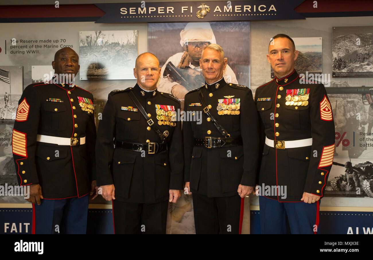 Sgt. Maj. Ronald L. Green, sergeant major of the Marine Corps, Gen. Robert B. Neller, commandant of the Marine Corps, Lt. Gen. Rex C. McMillian, commander of Marine Forces Reserve and Marine Forces North, and Sgt. Maj. Patrick L. Kimble, sergeant major of MARFORRES and MARFORNORTH, pose for a photo at a ribbon-cutting ceremony for the official unveiling of the Marine Corps Reserve Centennial wall display at the Pentagon, Arlington, Va., Nov. 9, 2016. The exhibit was installed at the Pentagon in conjunction with the 100th anniversary of the Marine Corps Reserve, which was celebrated Aug. 29, 20 Stock Photo