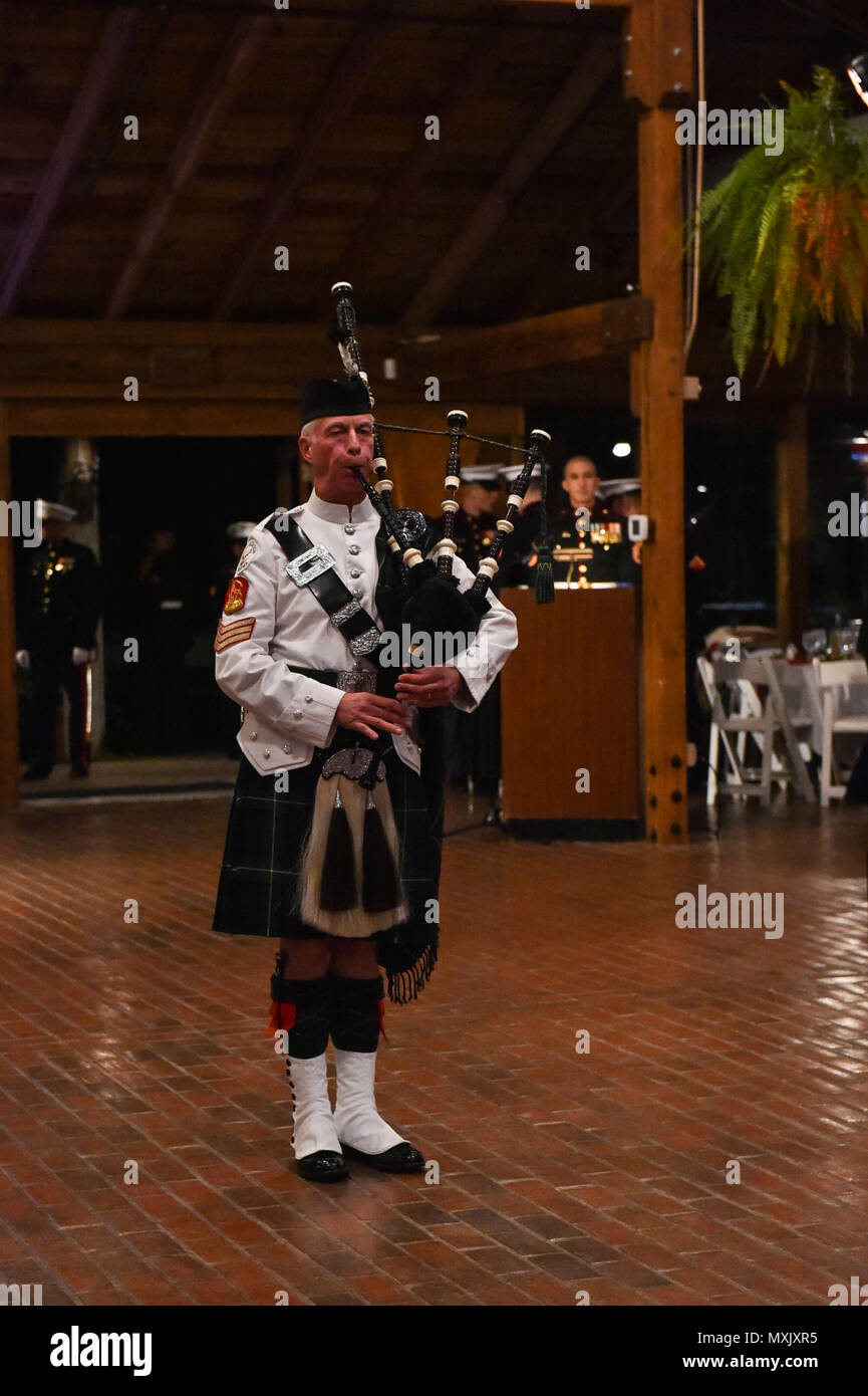 161104-N-OO032-007 POULSBO, Wash. (Nov. 4, 2016) Retired Gunnery Sgt. Van Bradley opens the the 241st United States Marine Corps birthday ball with a bagpipe performance. The event was hosted by Marine Corps Security Force Battalion-Bangor at the Kiana Lodge. Maj. Gen. John Lejeune issued General Order 47 on November 1, 1921, for Marines to commemorate the establishment of the Continental Marines — November 10, 1775. (U.S. Navy photo by Petty Officer 1st Class Cory Asato/Released) Stock Photo