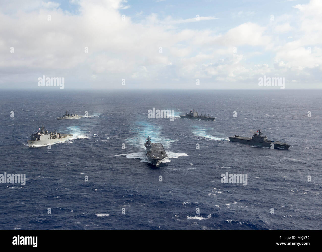 161106-N-ZK021-239 PACIFIC OCEAN (Nov. 6, 2016) - Ships participating in Keen Sword 2017 steam in formation during a photo exercise. Keen Sword 17 is a joint and bilateral field training exercise (FTX) between U.S. and Japanese forces meant to increase readiness and interoperability within the framework of the U.S. – Japan alliance. (U.S. Navy photo by Petty Officer First Class Nardel Gervacio/Released) Stock Photo