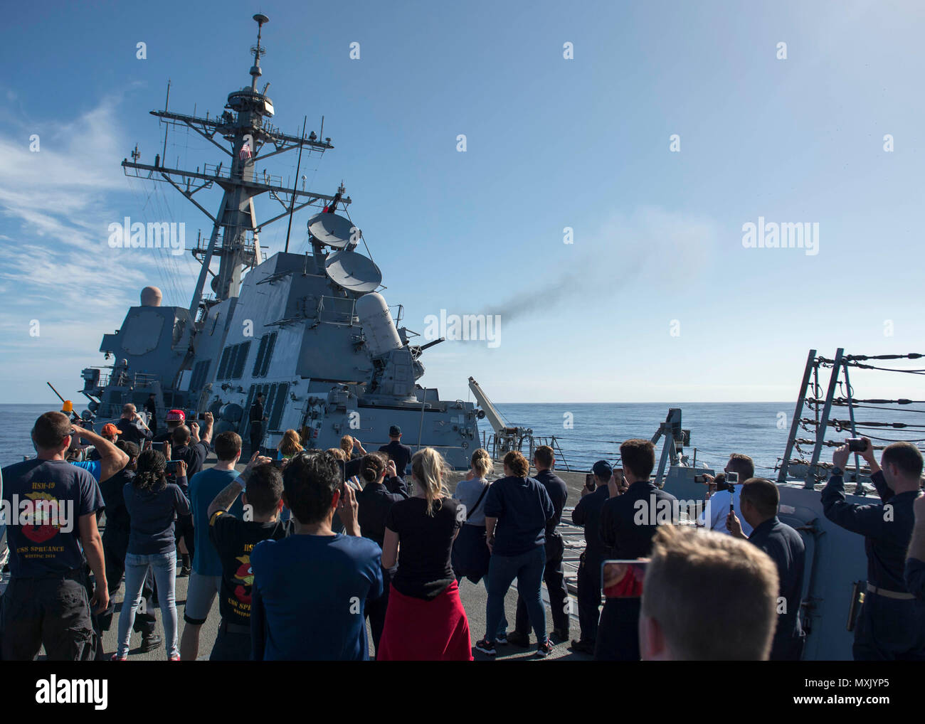 161110-N-SU278-190 PACIFIC OCEAN (Nov. 9, 2016) Sailors assigned to the guided-missile destroyer USS Spruance (DDG 111) and embarked friends and family members aboard during a tiger cruise watch a demonstration of the ship’s close-in weapons system in the Pacific Ocean, Nov. 9, 2016. Spruance and the guided-missile destroyers USS Decatur (DDG 73) and USS Momsen (DDG 92), along with embarked “Warbirds” and “Devilfish” detachments of Helicopter Maritime Strike Squadron (HSM) 49, are finishing up a seven-month deployment in support of maritime security and stability in the Indo-Asia-Pacific as pa Stock Photo