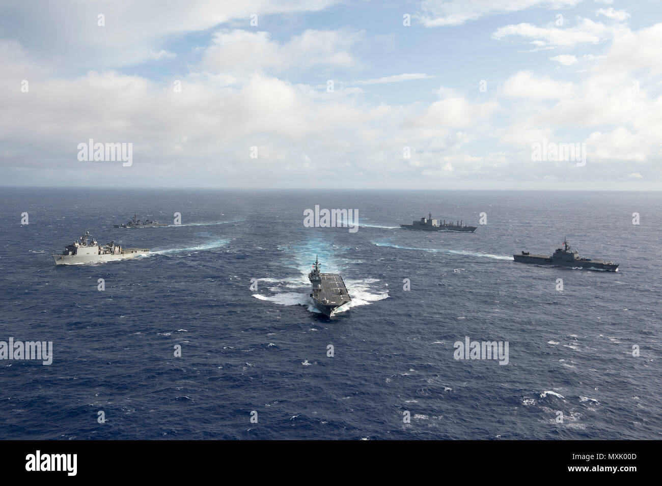 161106-N-ZK021-255 PACIFIC OCEAN (Nov. 6, 2016) - Ships participating in Keen Sword 2017 steam in formation during a photo exercise. Keen Sword 17 is a joint and bilateral field training exercise (FTX) between U.S. and Japanese forces meant to increase readiness and interoperability within the framework of the U.S. – Japan alliance. (U.S. Navy photo by Petty Officer First Class Nardel Gervacio/Released) Stock Photo