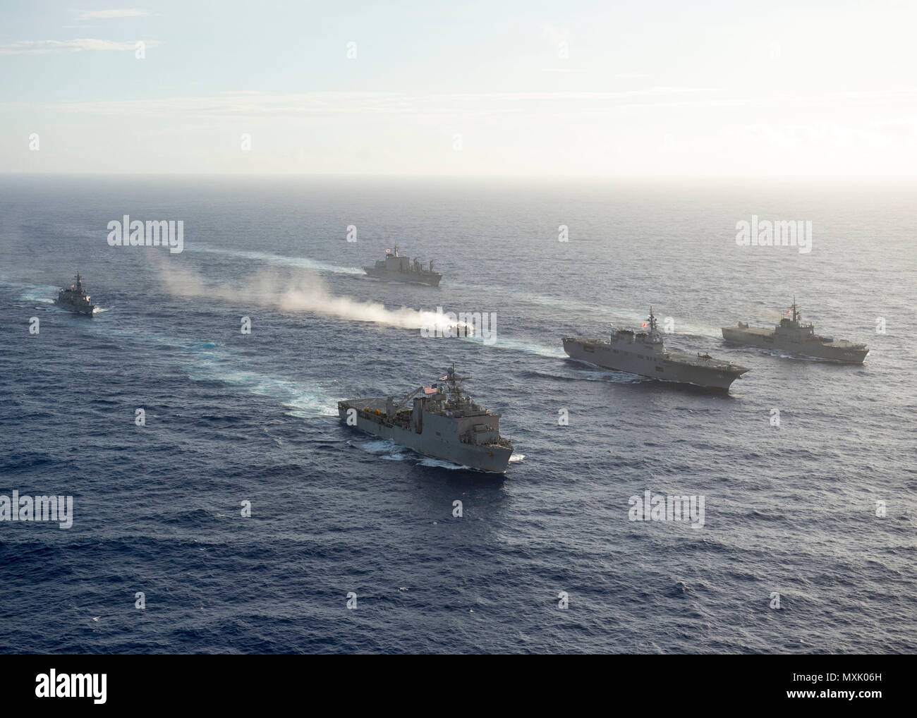 161106-N-ZK021-160 PACIFIC OCEAN (Nov. 6, 2016) - Ships participating in Keen Sword 2017 steam in formation during a photo exercise. Keen Sword 17 is a joint and bilateral field training exercise (FTX) between U.S. and Japanese forces meant to increase readiness and interoperability within the framework of the U.S. – Japan alliance. (U.S. Navy photo by Petty Officer First Class Nardel Gervacio/Released) Stock Photo
