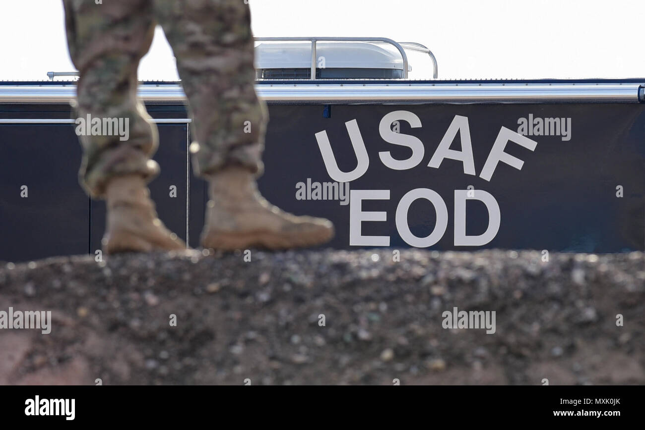 An explosive ordnance disposal member stands in front of an EOD vehicle  during a controlled explosion display at Ellsworth Air Force Base, S.D.,  Nov. 14, 2016. EOD demonstrated the steps of setting