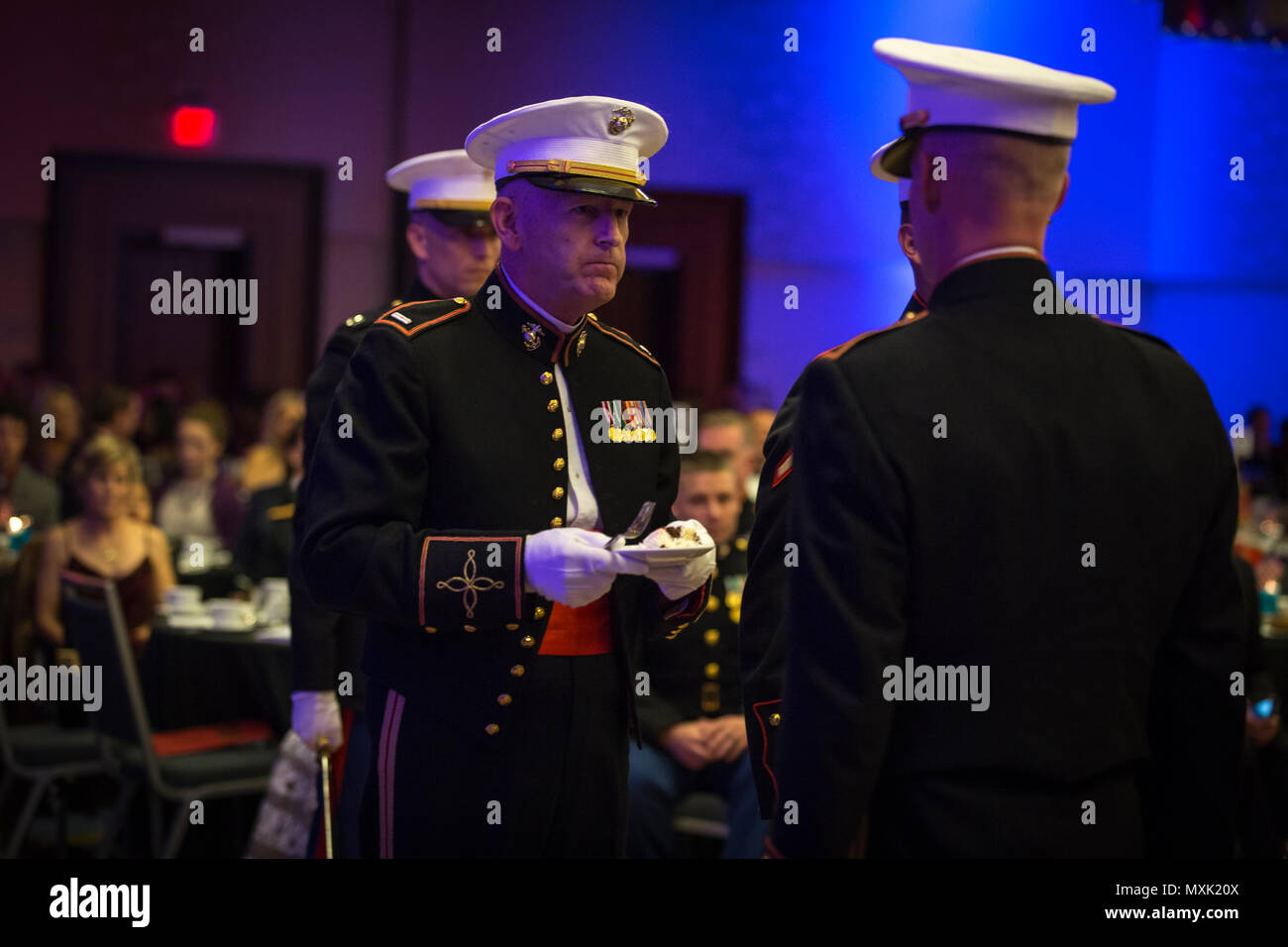 U.S. Marine Corps Chief Warrant Officer 5 Michael W. Edmonson, head of Marine Corps Field Bands, Office of United States Marine Corps Communication, eats a piece of cake during he Headquarters & Service Battalion Marine Corps Ball, Renaissance Arlington Capitol View Hotel, Arlington, Va., Nov. 05, 2016. Edmonson was recognized as the oldest Marine present during the celebration of the Marine Corps’ 241st birthday. (U.S. Marine Corps photo by Pfc. Alex A. Quiles) Stock Photo