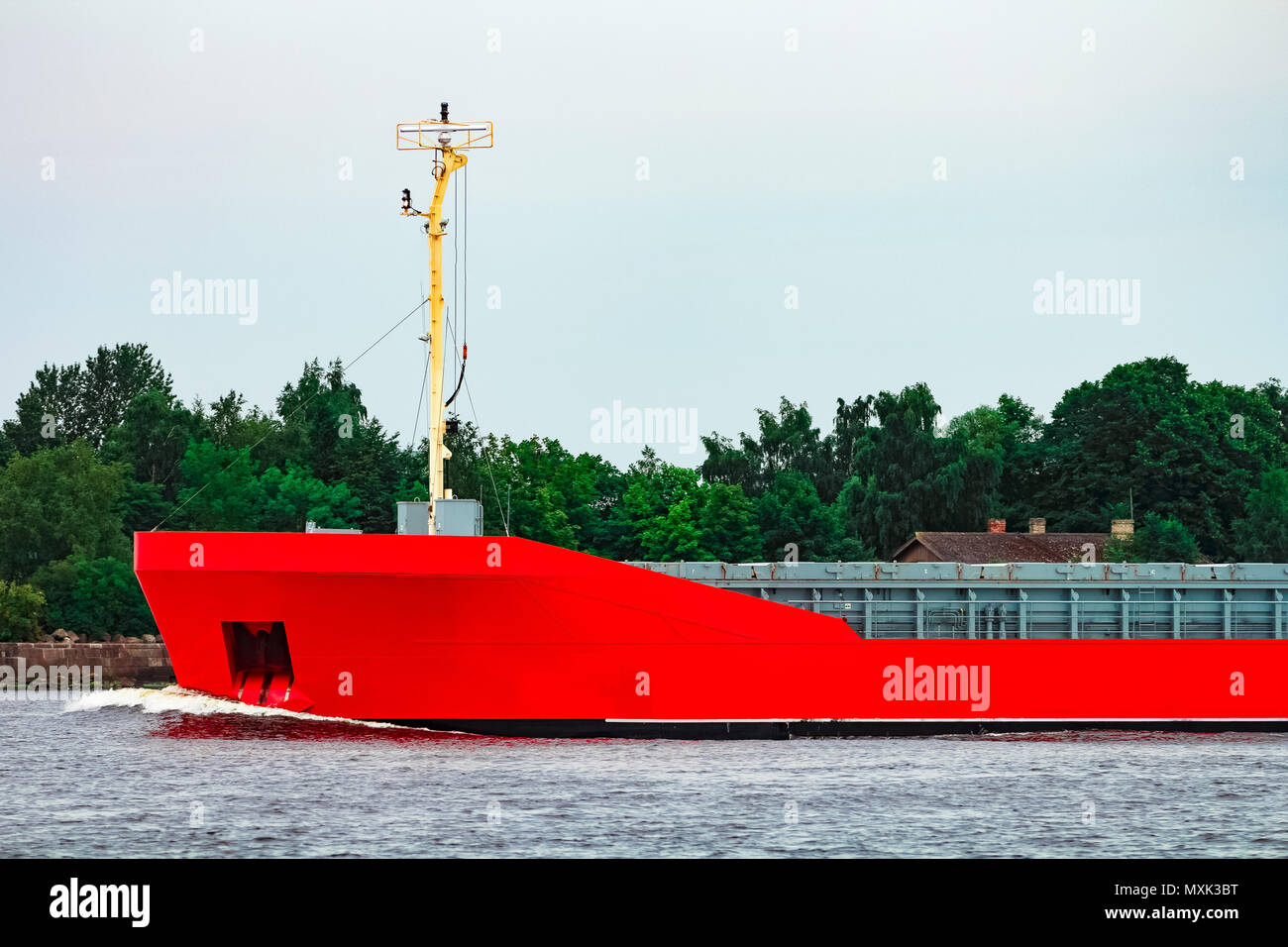 Orange cargo ship. Logistics and merchandise transportations Stock