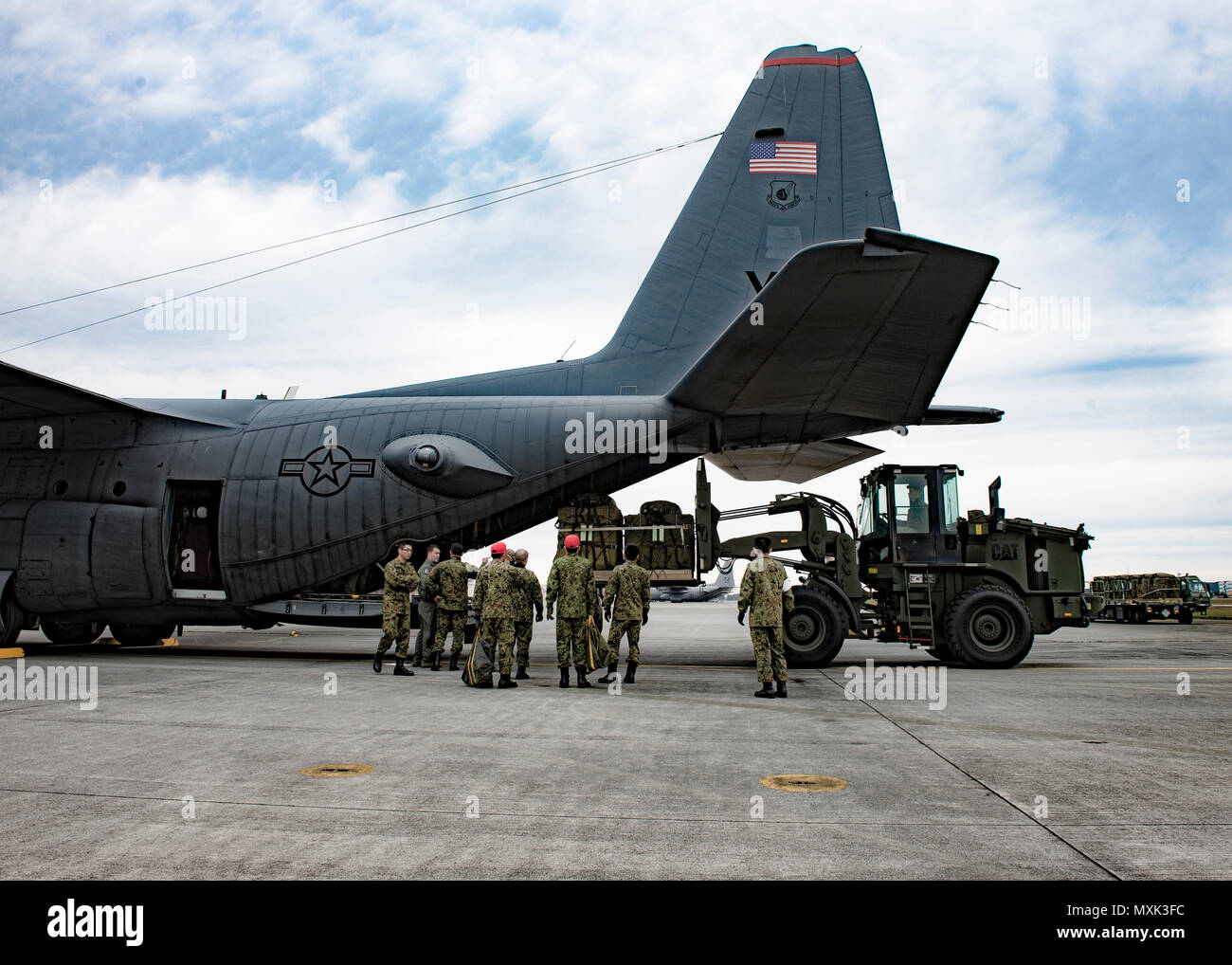 36th Airlift Squadron C-130H loadmasters show Japan Ground Self-Defense Force members how they load cargo during Keen Sword 2017 on Nov. 10, 2016, at Yokota Air Base, Japan. Keen Sword is the largest joint, bilateral field training exercise between the U.S. military and the Japan Self-Defense Force. (U.S. Air Force photo by Airman 1st Class Donald Hudson/Released) Stock Photo