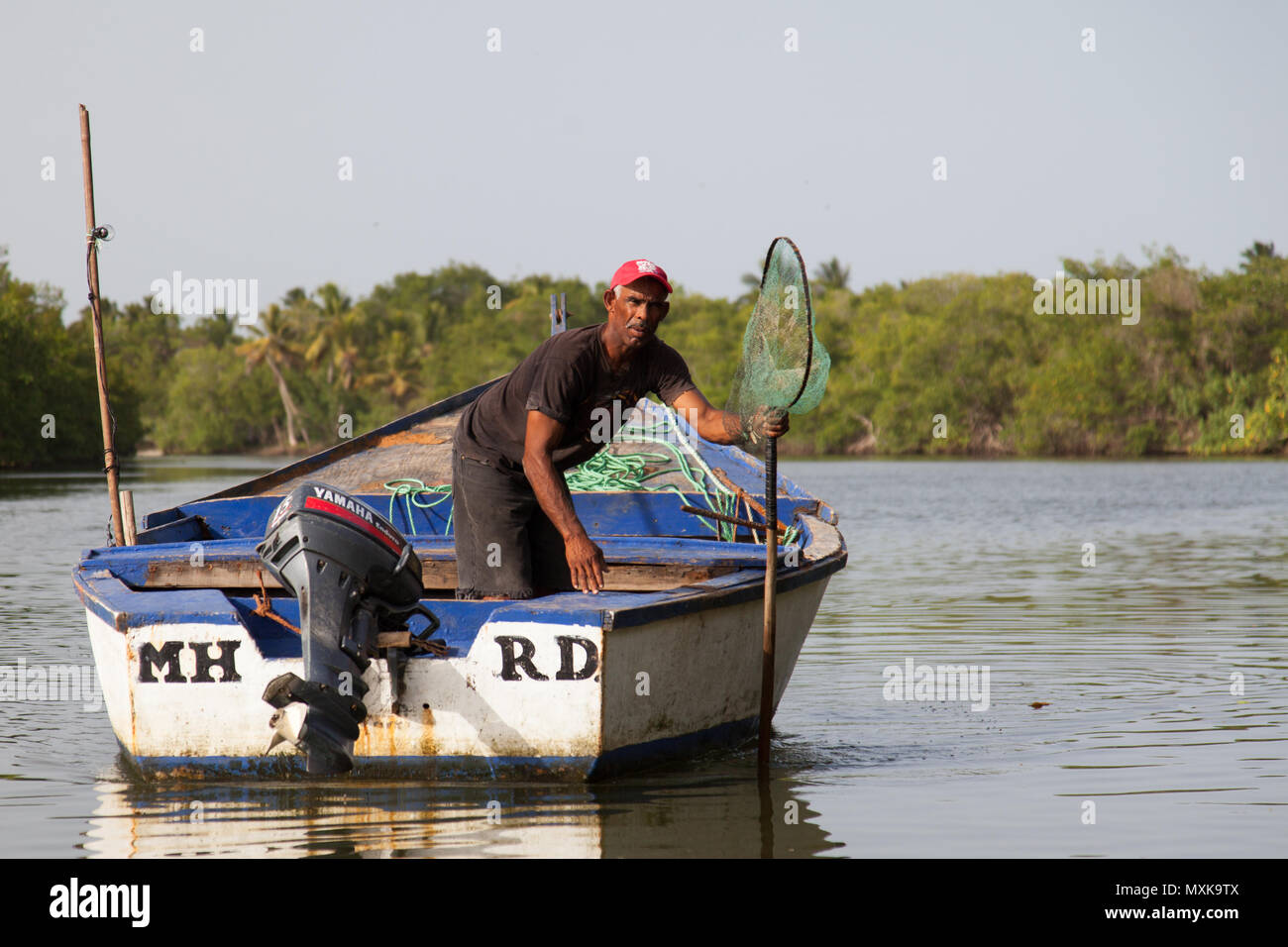 Fisherman on his way out to sea to fish in Miches, Dominican Republic. Stock Photo