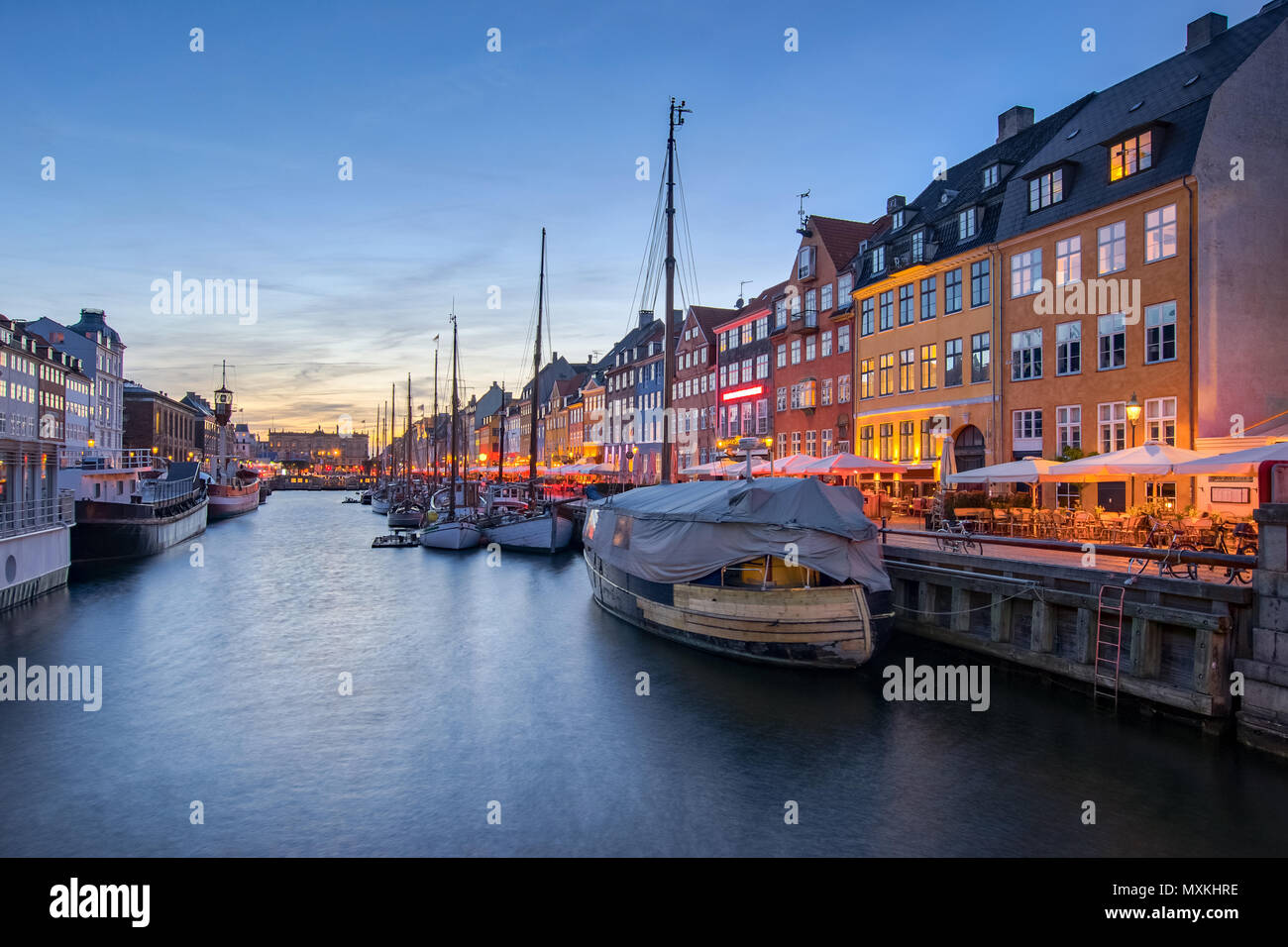 Nyhavn the waterfront canal at night in Copenhagen, Denmark Stock Photo ...