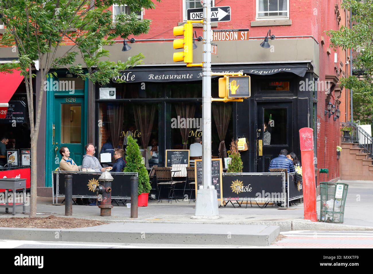 Mole, 57 Jane St, New York, NY. exterior storefront of a restaurant, and sidewalk cafe in the West Village neighborhood of Manhattan. Stock Photo