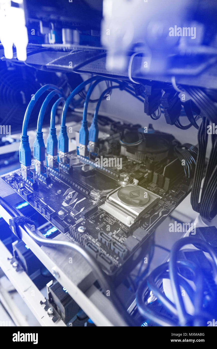 Graphics processing units connected to motherboard with cables Stock ...