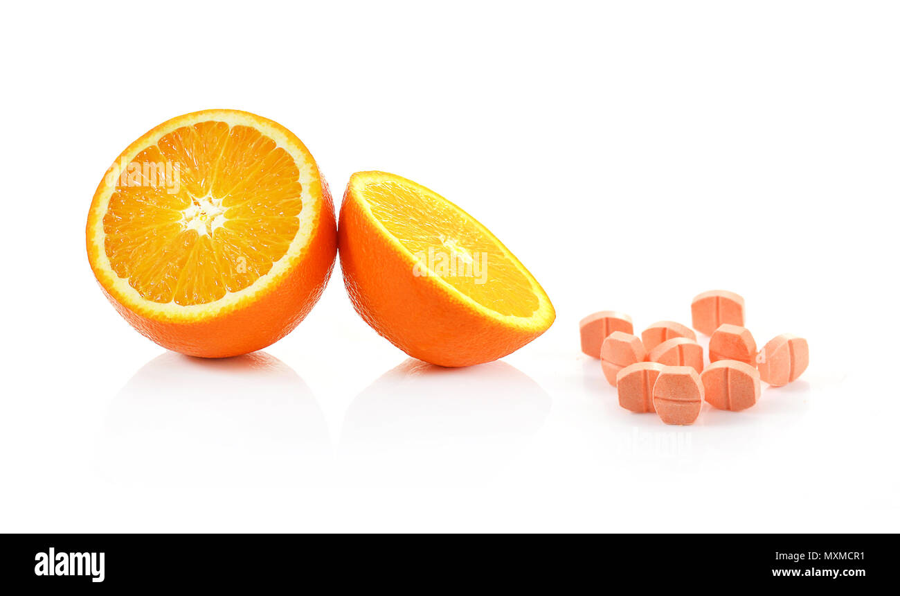 Orange fruit with vitamin c tablet on white background Stock Photo Alamy
