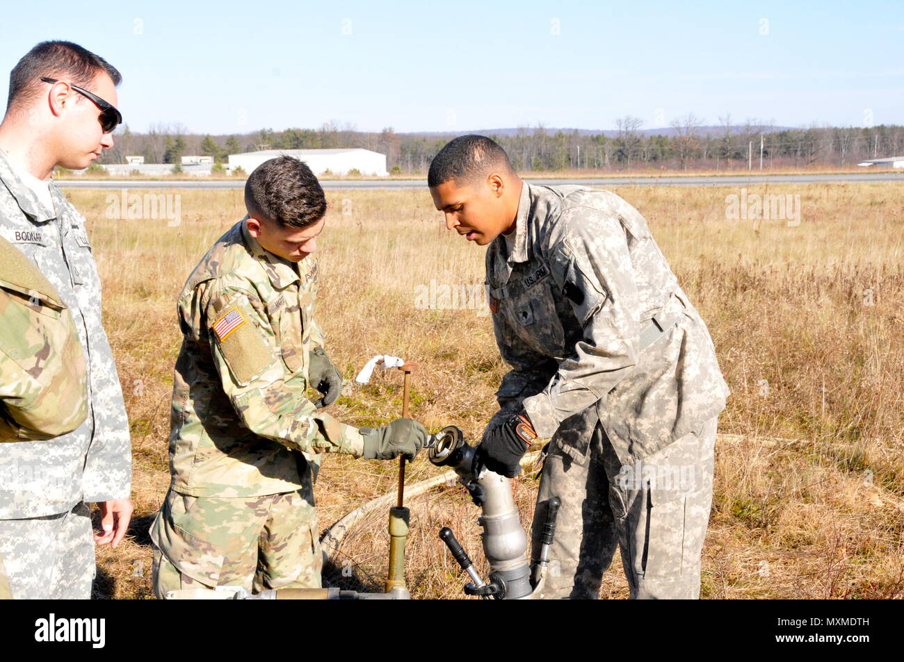 U.S. Army Spc. Justin Rush, right, petroleum supply specialist with