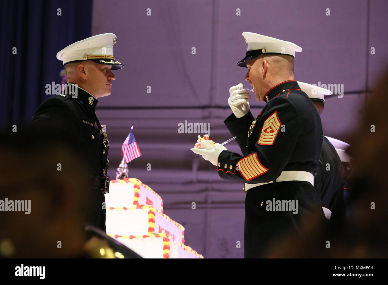 Sgt. Maj. Benjamin Pangborn takes a bite of the birthday cake during
