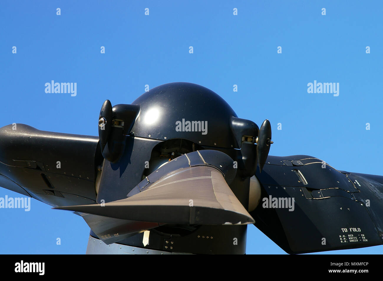 Rotors and hub of V-22 Osprey. Bell Boeing V-22 Osprey tiltrotor engineering. Transformer technology. Blades. Blue sky Stock Photo