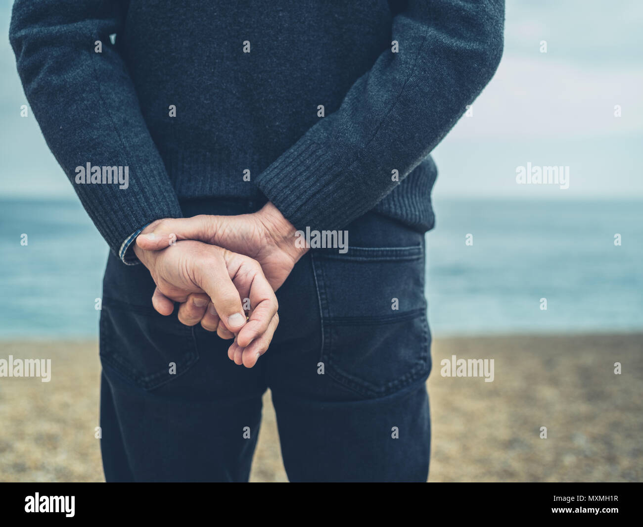 Old man hands behind back hi-res stock photography and images - Alamy