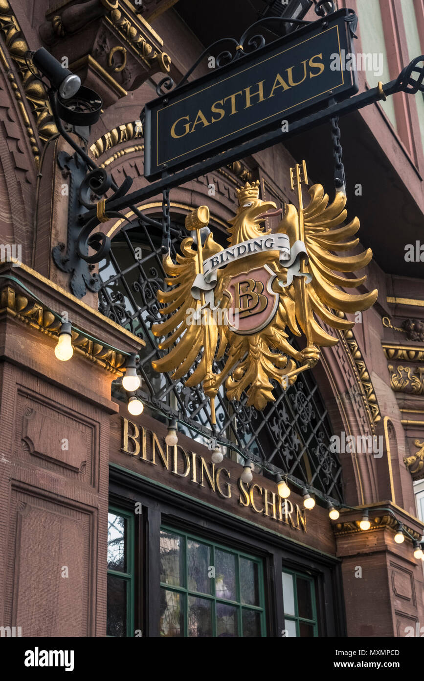 Ornate decoration and sign on the Binding-Schirn Gasthaus located in the historic old town (Altstadt) district of Frankfurt am Main, Hesse, Germany Stock Photo