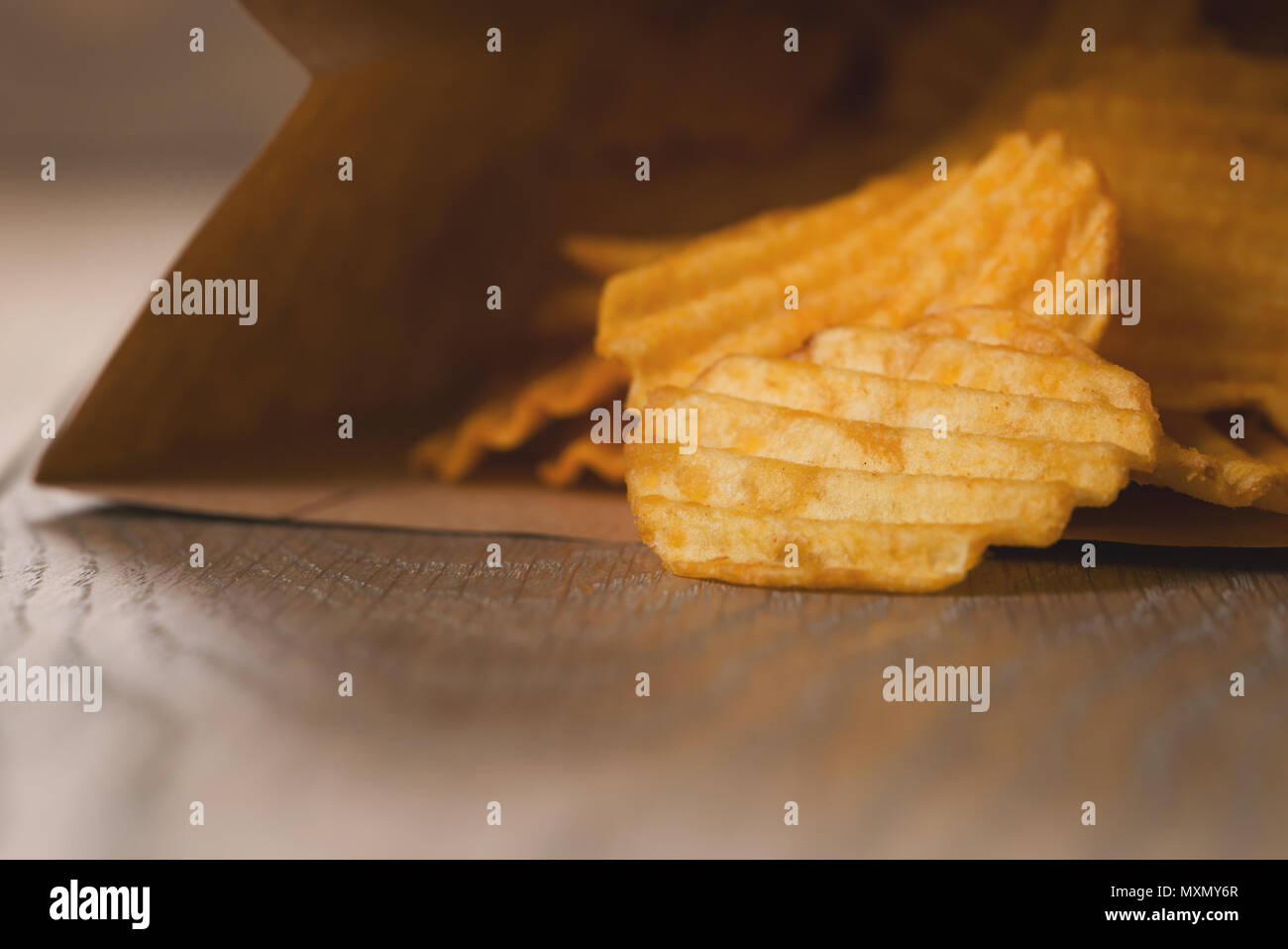 rippled potato chips in paper bag Stock Photo Alamy