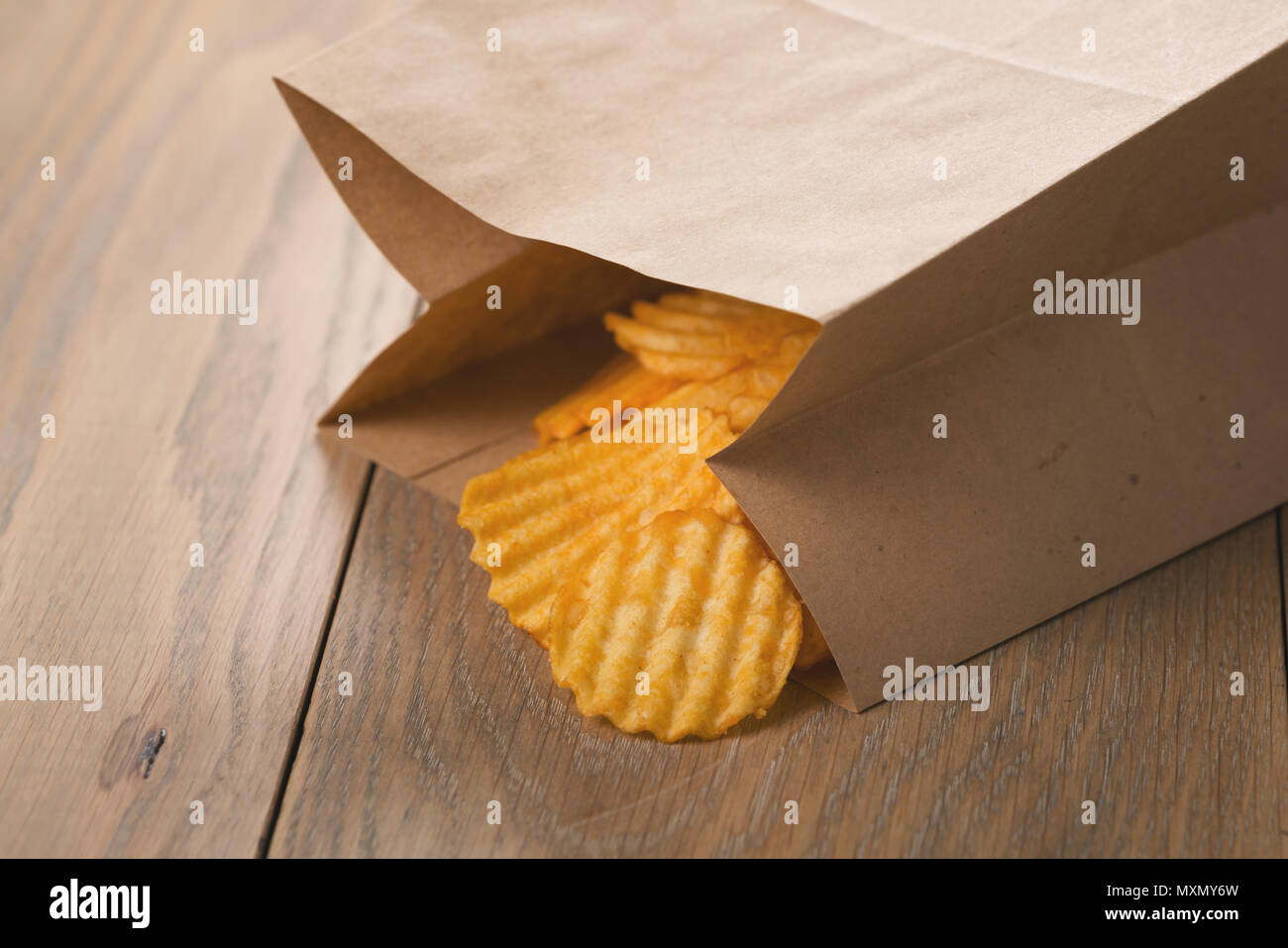 rippled potato chips in paper bag Stock Photo Alamy
