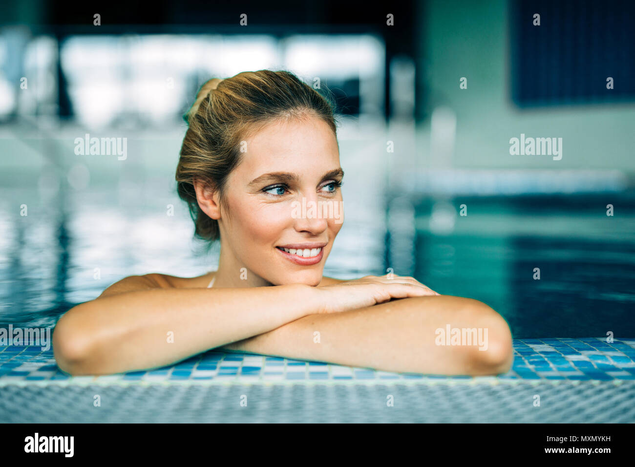 Portrait of beautiful woman relaxing in swimming pool Stock Photo - Alamy