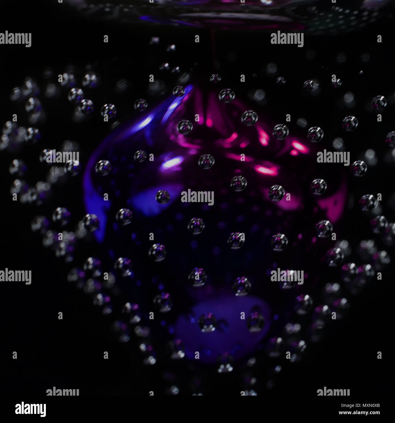 Handmade beautiful art glass with bubbles inside. Close up photo as