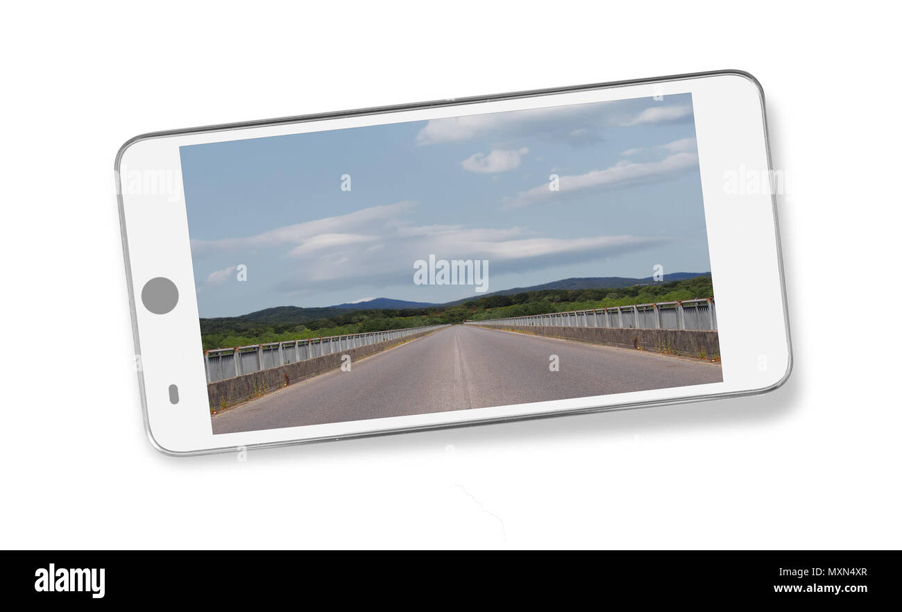 Mobile phone, anonymized, with inset open road, horizon image. All my photos. With shadow on white. Stock Photo