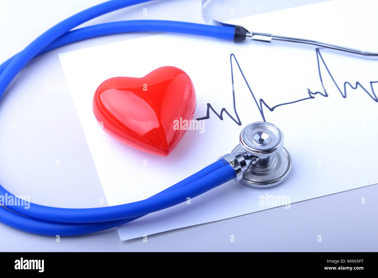 Medical stethoscope and red heart with cardiogram isolated on white ...