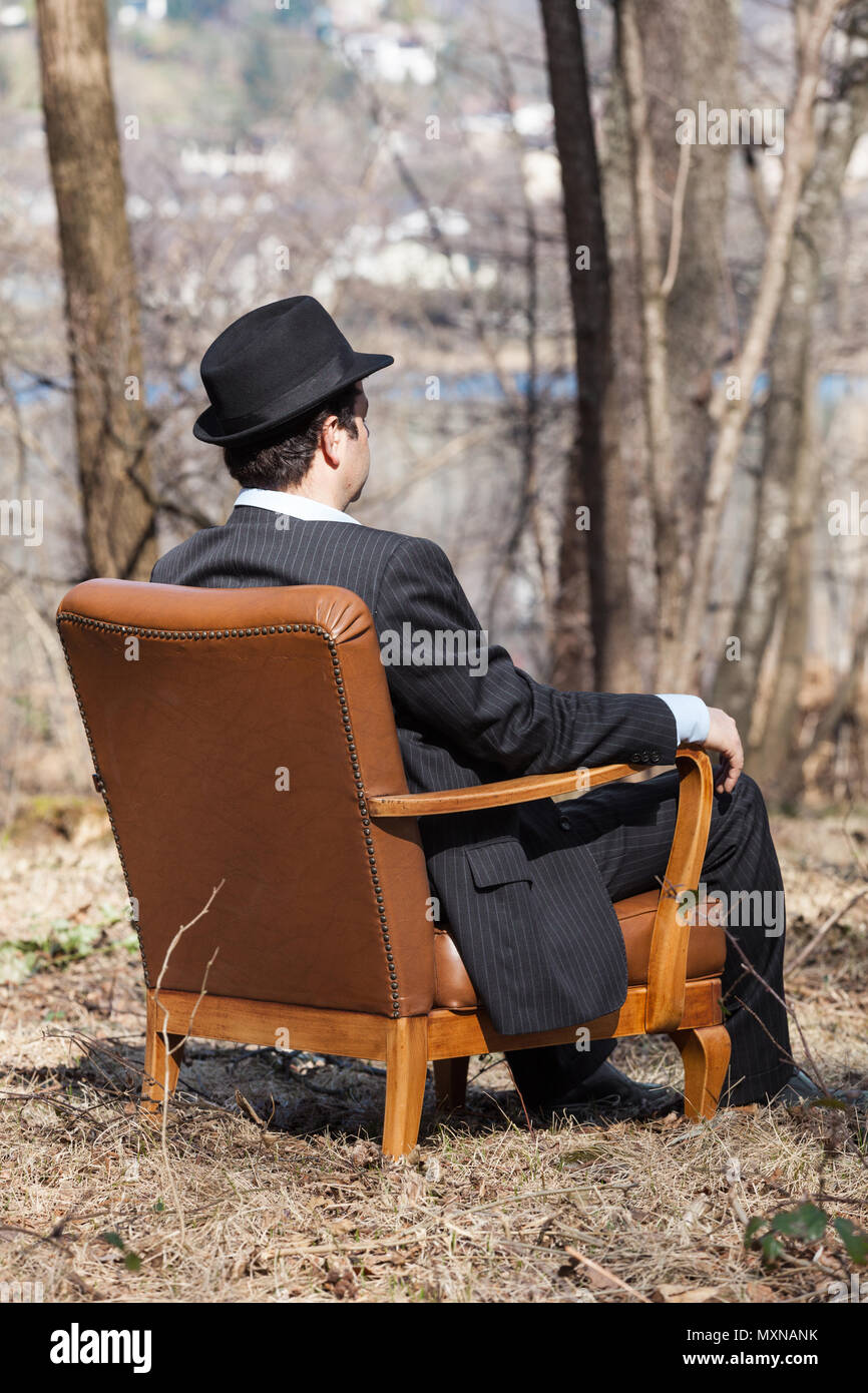 sitting in armchair