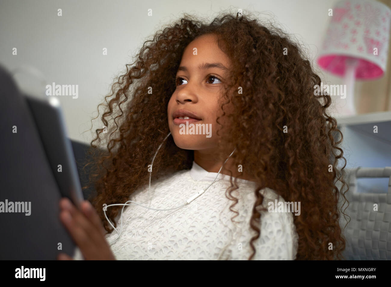 Portrait Of A Young Preteen Mixed Race Girl With Big Curly Hair
