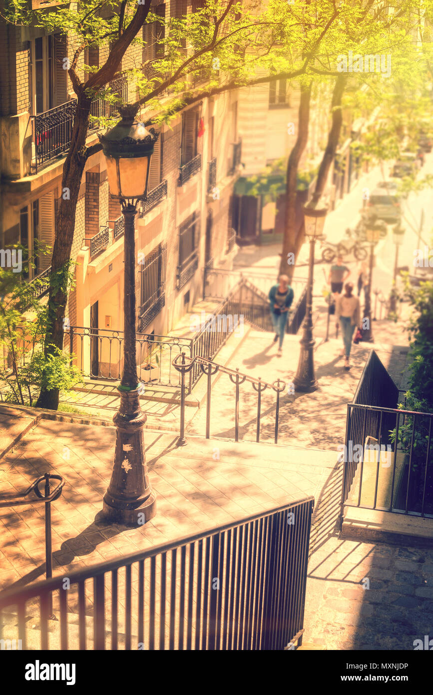Typical Montmartre staircase and old street lamp, golden sunny light in Paris France Stock Photo