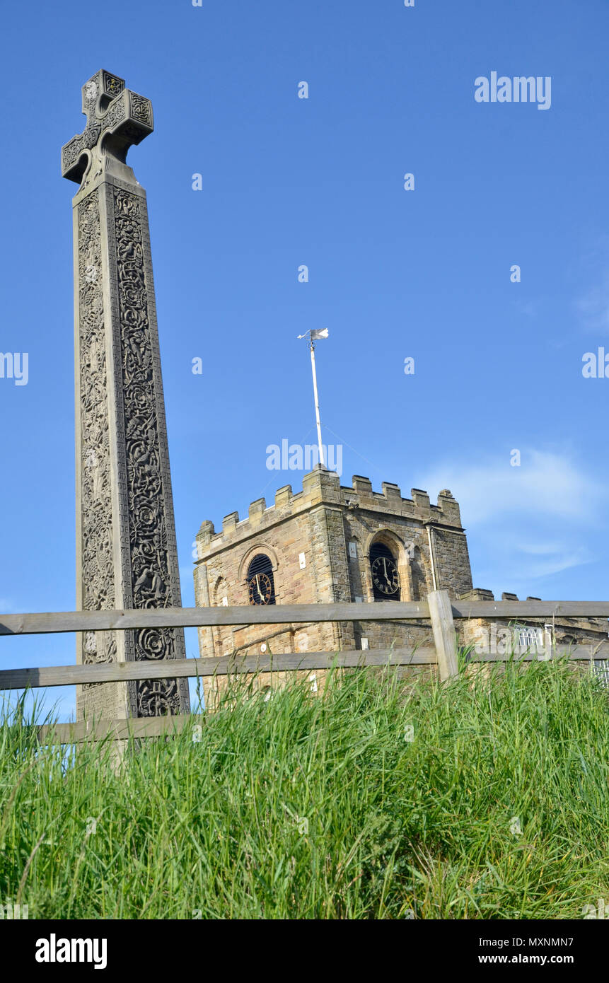 St. Mary's Church and Caedmon's Cross in Whitby, North Yorkshire. the graveyard was used as a setting for bram Stoker's Dracula Stock Photo