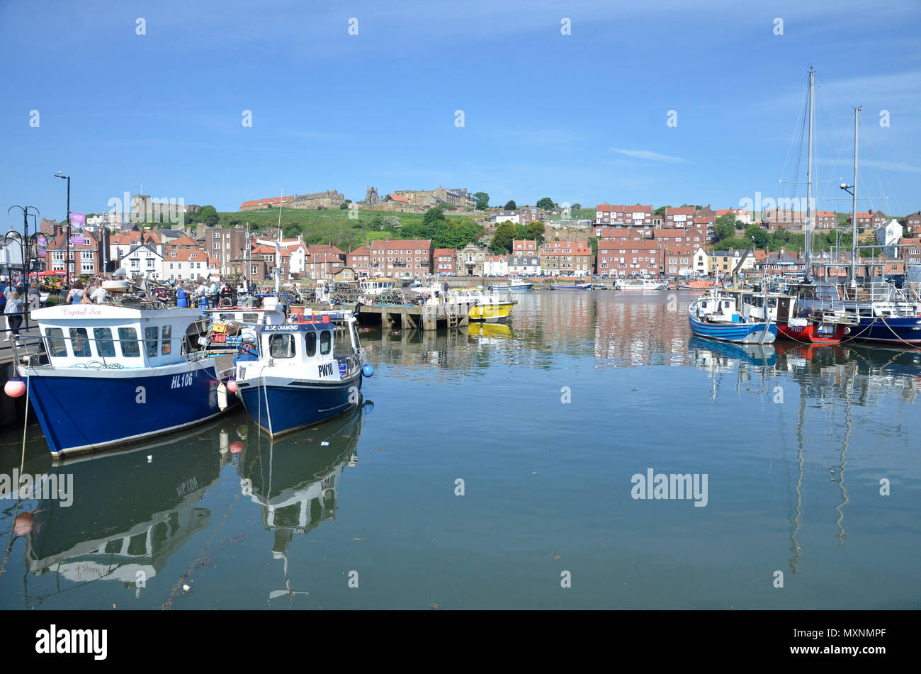 The marina and Harbour at Whitby in North Yorkshire on a busy bank ...