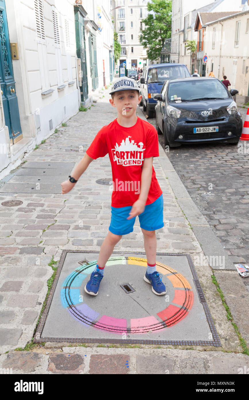 Nine year old boy flossing in Montmartre, Paris, France Stock Photo