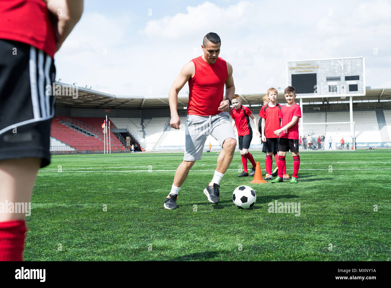 Football Coach Teaching by Example Stock Photo Alamy