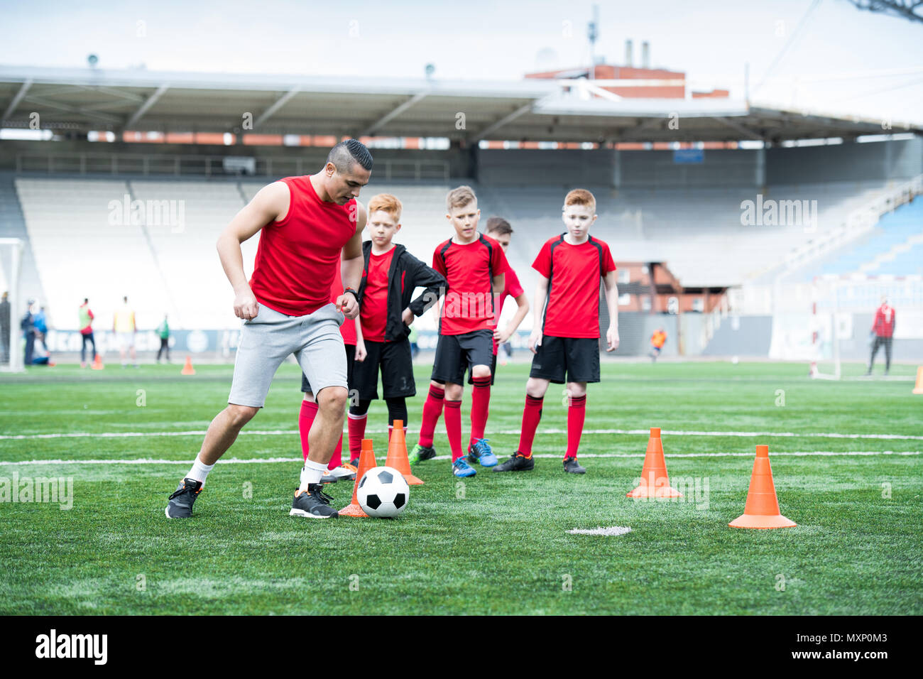 Coach Showing Football Exercise at Practice Stock Photo Alamy