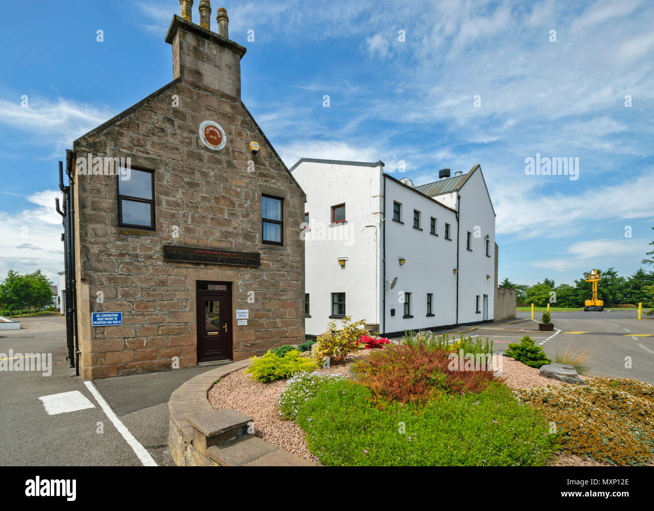 ROYAL BRACKLA WHISKY DISTILLERY CAWDOR ESTATE NAIRN SCOTLAND OFFICE BUILDINGS AND SMALL GARDEN