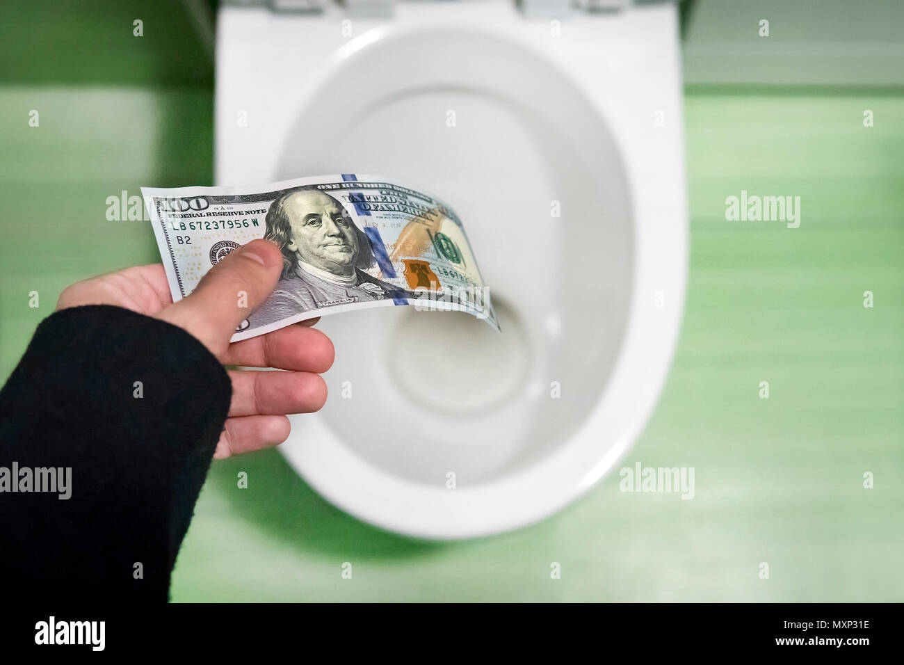 concept of senseless waste of money, loss, useless waste, large water