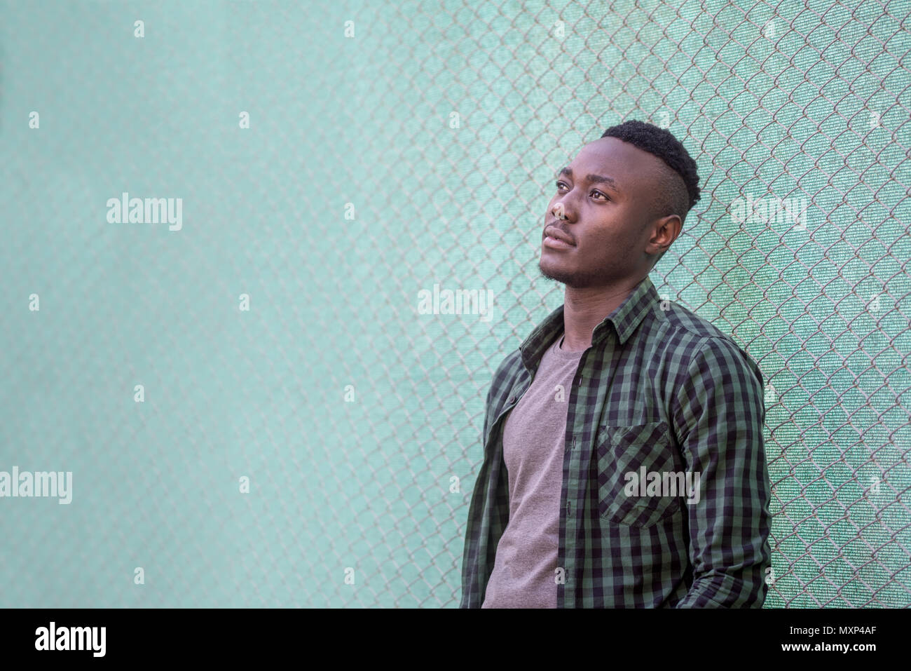 Thoughtful black male model. Urban life. Pensive African American man outdoors, style concept. Stock Photo